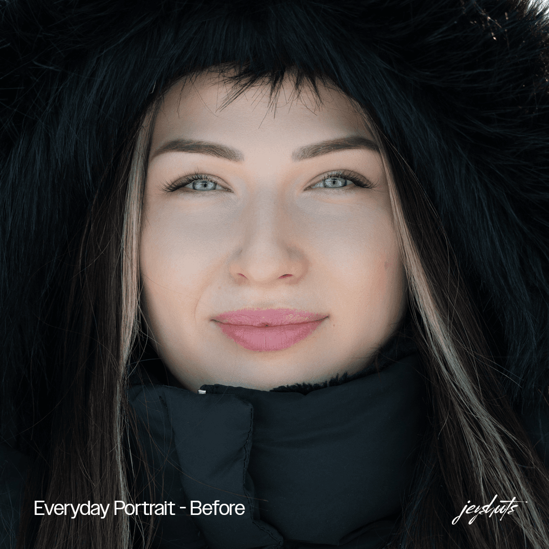 Naisen lähimuotokuva mustassa talvihupussa – Everyday Portrait, lähtökuva ennen presettiä.